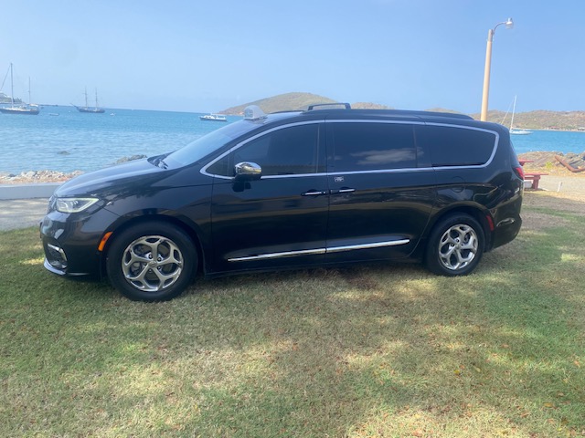 Driver side of the black Chrysler Pacifica taxi